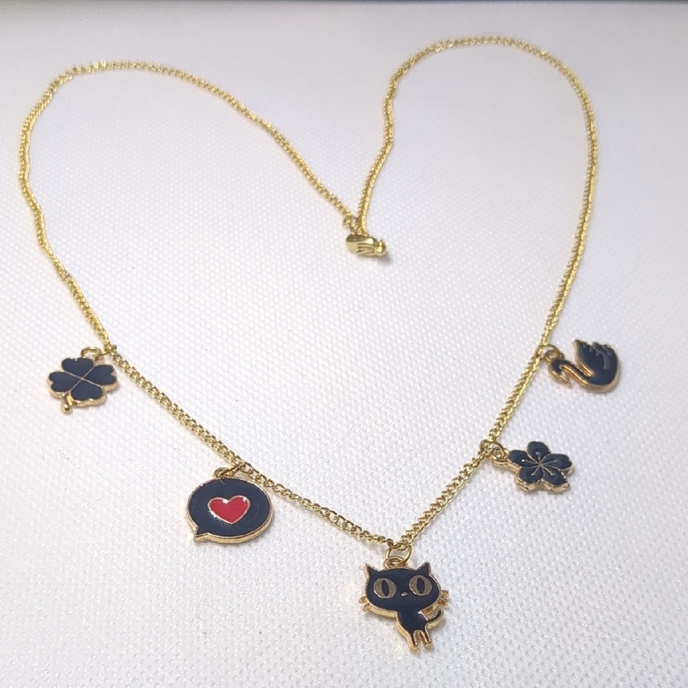 Gold and Black Necklace with Playful Charms